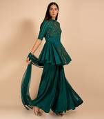 Green Peplum Top Paired With Flared Palazzo Set