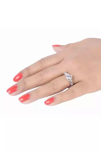 Heart Shaped Solitaire With Baguettes On Either Side