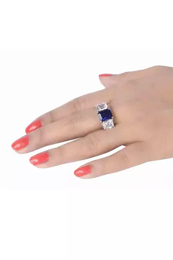 Blue Sapphire Center With Emerald Cut Diamonds On Either Side