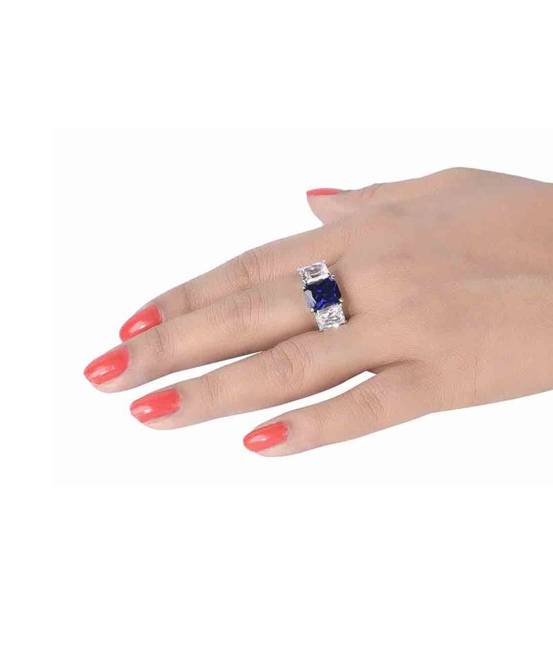 Blue Sapphire Center With Emerald Cut Diamonds On Either Side