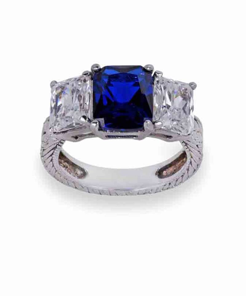 Blue Sapphire Center With Emerald Cut Diamonds On Either Side