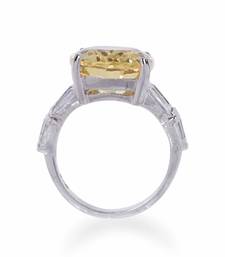 Radiant Cut Yellow Sapphire With Baguettes On Either Side