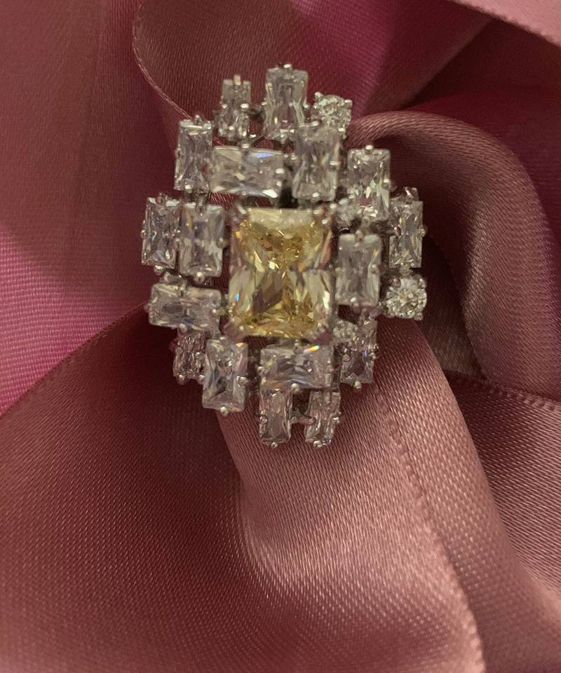 Yellow Center With Uneven Setting Of Diamond Cluster