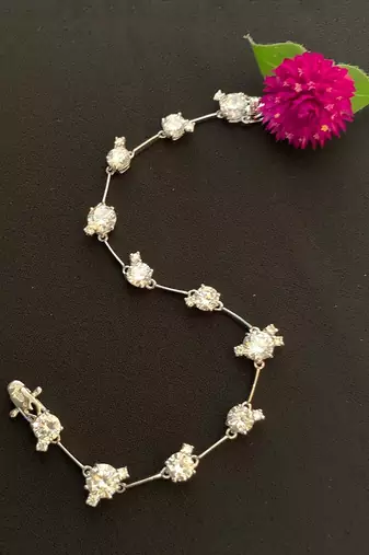 Round Solitaire With Small Stones Attached - Tennis Bracelet