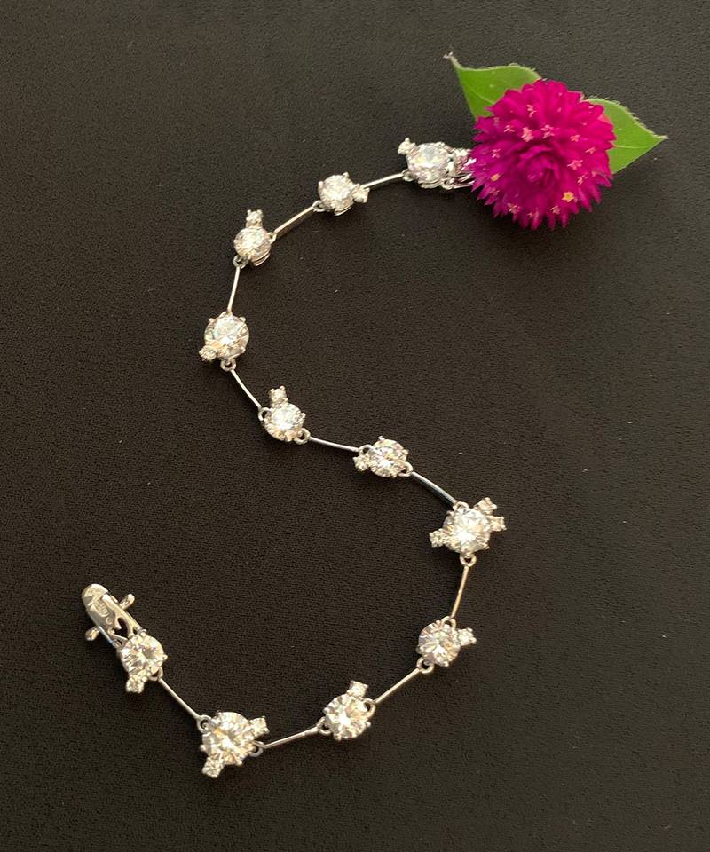 Round Solitaire With Small Stones Attached - Tennis Bracelet