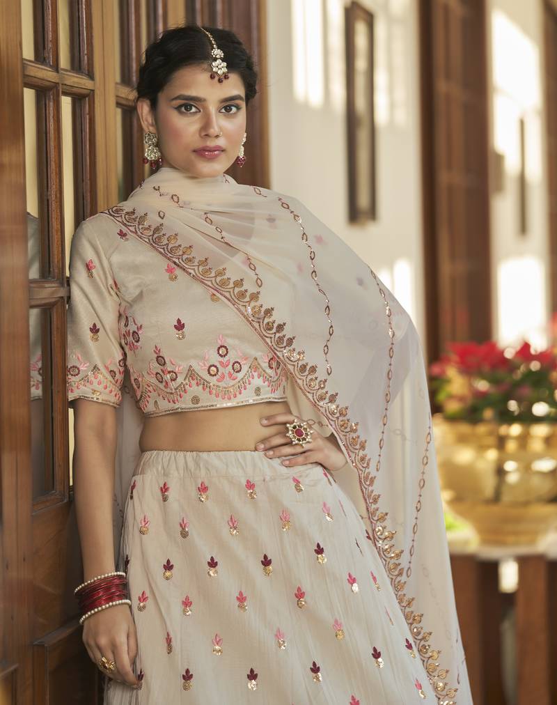 BEIGE MAROON THREAD AND SEQUINS EMBROIDERED WITH MIRROR WORK ART SILK FESTIVE & PARTY WEAR SEMI STITCHED LEHENGA