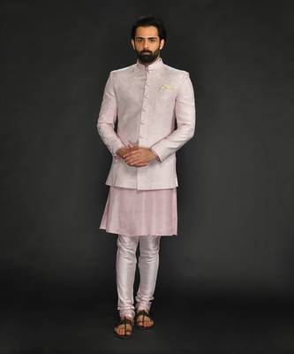 Powder Pink Silk Mirror Textured  Bandhgala With Plain Kurta And Slim Pants. 1