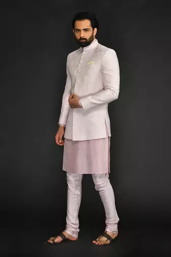 Powder Pink Silk Mirror Textured  Bandhgala With Plain Kurta And Slim Pants.