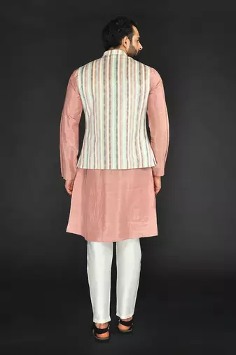 Off White Imported Russian Printed Bundi With Vis. Silk Peach Kurta Paired With Off White Spun Silk Chudidar.