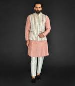 Off White Imported Russian Printed Bundi With Vis. Silk Peach Kurta Paired With Off White Spun Silk Chudidar.