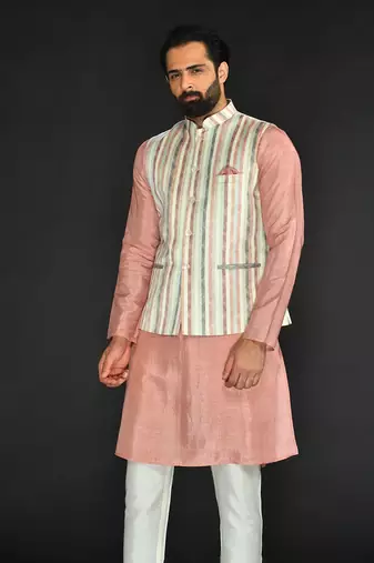 Off White Imported Russian Printed Bundi With Vis. Silk Peach Kurta Paired With Off White Spun Silk Chudidar.