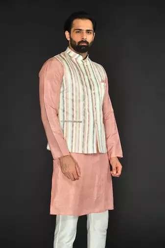 Off White Imported Russian Printed Bundi With Vis. Silk Peach Kurta Paired With Off White Spun Silk Chudidar.