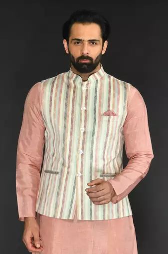 Off White Imported Russian Printed Bundi With Vis. Silk Peach Kurta Paired With Off White Spun Silk Chudidar.