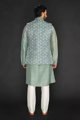 Dull Mint Green Imported Velvet Printed Long Bundi Paired With Vis. Silk Kurta And Spun Silk Chudidar.