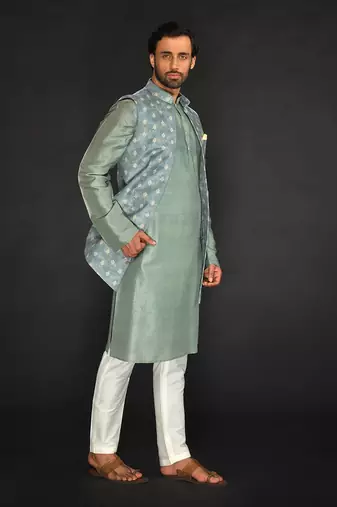 Dull Mint Green Imported Velvet Printed Long Bundi Paired With Vis. Silk Kurta And Spun Silk Chudidar.