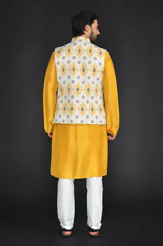 Off White Poly. Khadi Textured Printed Bundi With Musterd Vis. Silk Kurta Paired With Off White Spun Cotton Chudidar.