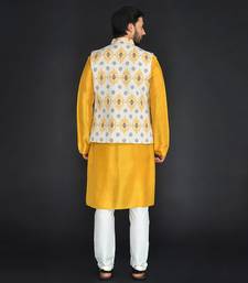 Off White Poly. Khadi Textured Printed Bundi With Musterd Vis. Silk Kurta Paired With Off White Spun Cotton Chudidar.
