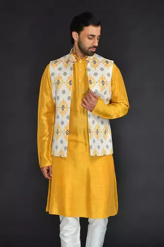 Off White Poly. Khadi Textured Printed Bundi With Musterd Vis. Silk Kurta Paired With Off White Spun Cotton Chudidar.