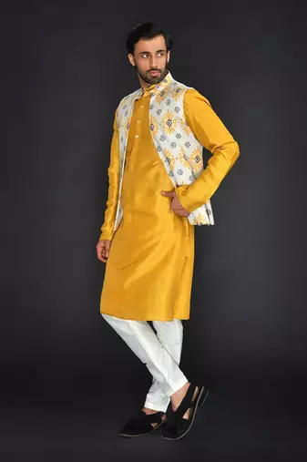Off White Poly. Khadi Textured Printed Bundi With Musterd Vis. Silk Kurta Paired With Off White Spun Cotton Chudidar.