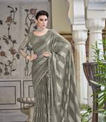 Cream embroidered satin saree with blouse