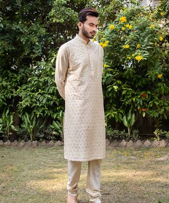 Beige Hand Embroidered Kurta Set. 1
