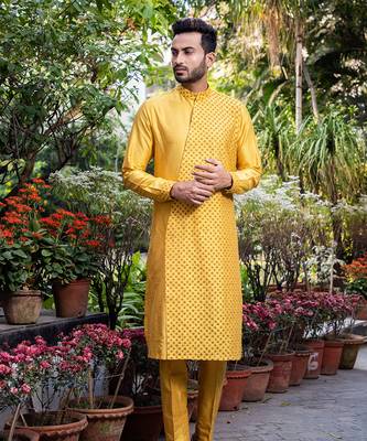 Mustard Embroidered Diagonal Cut Kurta With Pants. 1