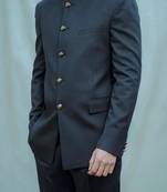 Navy blue bandhgala Paired with inner white band collar shirt & black straight pants.