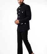 safari style Jodhpuri suit with pearl buttons. Paired with pant.