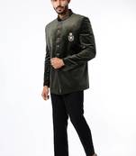 Jodhpuri with embroidered butta. Paired with black pant.