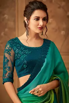 Green embroidered silk blend saree with blouse