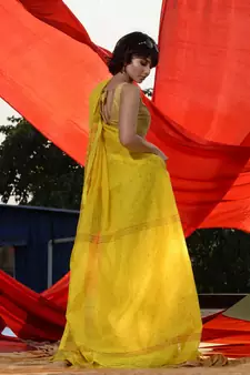 Yellow Cotton Blend Handwoven Saree With Geometric Motifs And Zari Stripes