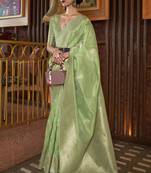 Light green woven silk saree with blouse