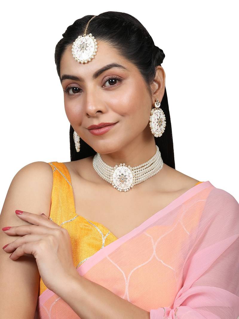 Traditonal Gold Plated Enameled White Colored Oval Shaped Pearl Layeed Choker Set with Earrings and Maangtikka Set