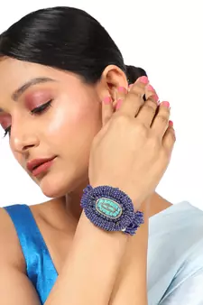 Contemporary Blue colored Beads studded Oval shaped Bracelet for Women and Girls.