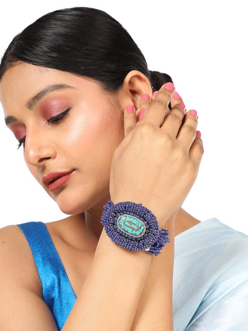Contemporary Blue colored Beads studded Oval shaped Bracelet for Women and Girls.