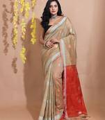 Beige Tissue Handwoven Saree With Dual Borders And Round Zari Motifs