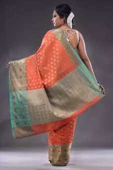Salmon Orange Cotton Blend Handwoven Saree With Zari Woven Texture And Floral Patterns