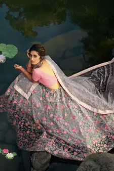 GREY SEQUINS AND THREAD EMBROIDERED SOFT NET FESTIVE & PARTY WEAR SEMI STITCHED LEHENGA