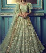 GREEN SEQUINS AND THREAD EMBROIDERED SOFT NET FESTIVE & PARTY WEAR SEMI STITCHED LEHENGA