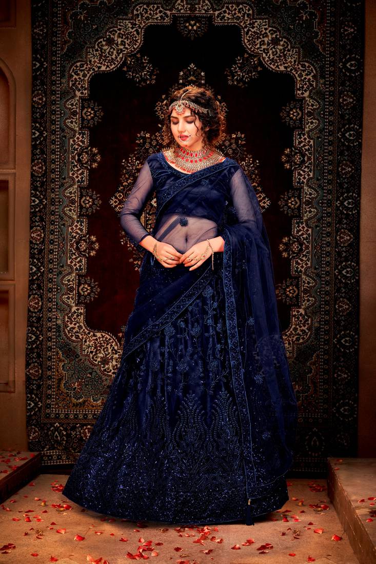 Purple embroidered net semi stitched lehenga