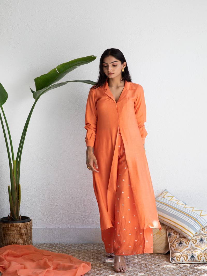Orange muslin Shirt paired with Purple embroidered pants
