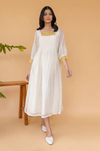 Yellow Organza With Pearl Detailing And Pleats In The Center Dress