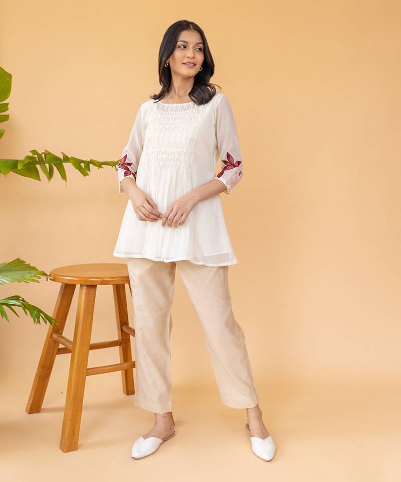 Red Embroidery On Sleeves With Smocking In The Center Top And Straight Cotton Pants In Beige