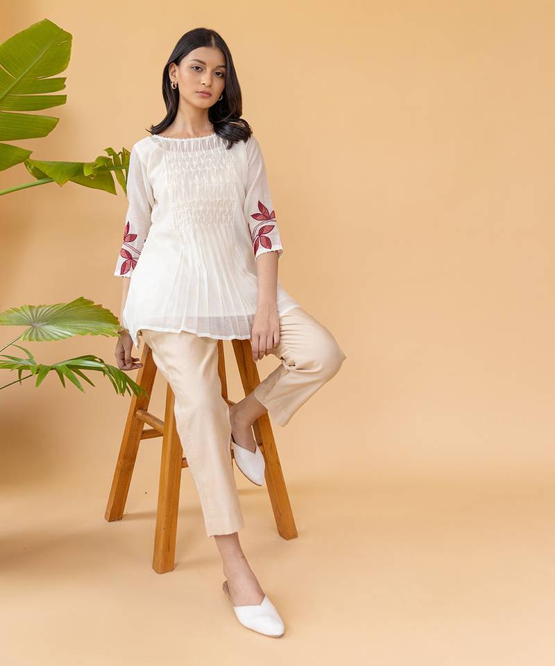 Red Embroidery On Sleeves With Smocking In The Center Top And Straight Cotton Pants In Beige
