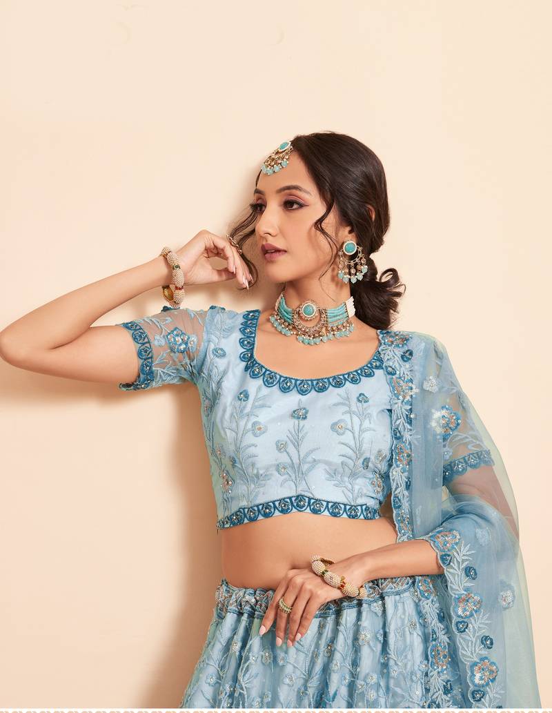 Bewitching Firozi sequins, thread, and zari Embroidered and hand embellished done all over the designer wedding lehenga