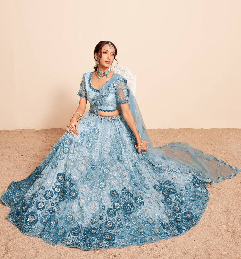 Bewitching Firozi sequins, thread, and zari Embroidered and hand embellished done all over the designer wedding lehenga