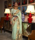 Light green woven silk saree with blouse