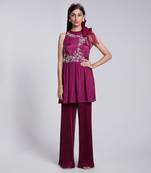 Beautiful Peplum Top With Tie Up At The Neckline Paired With Crush Fabric Pants.