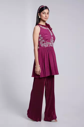Beautiful Peplum Top With Tie Up At The Neckline Paired With Crush Fabric Pants.