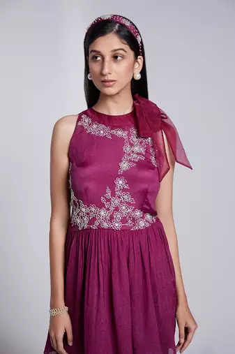 Beautiful Peplum Top With Tie Up At The Neckline Paired With Crush Fabric Pants.